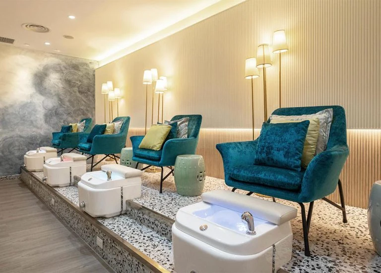 Foot spa room with teal armchairs and porcelain basins at Treasure Spa in Siam Square One, a massage in Siam Bangkok
